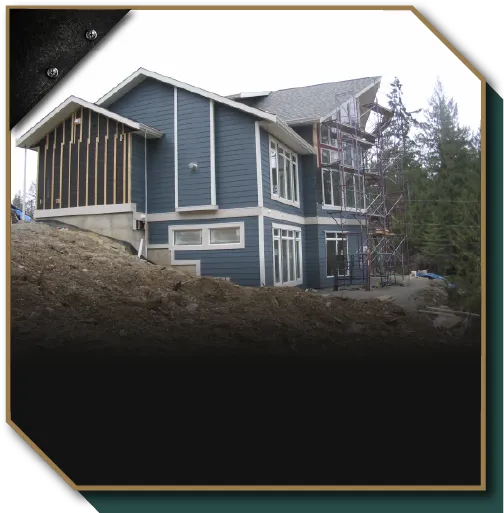 Commercial and residential construction project with custom home exterior framing and siding by Mad Oak.